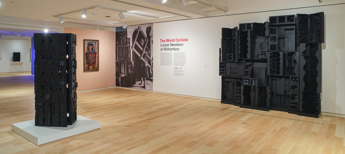Museum gallery displaying sculptures.