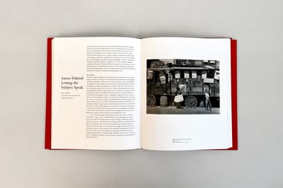 Act of Sight: The Tsiaras Family Photography Collection publication open to two page spread