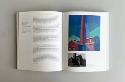 Interior spread of a book. On the right hand page there are two images, one of a painting and one of a photograph and caption information. On the left hand side there is text.