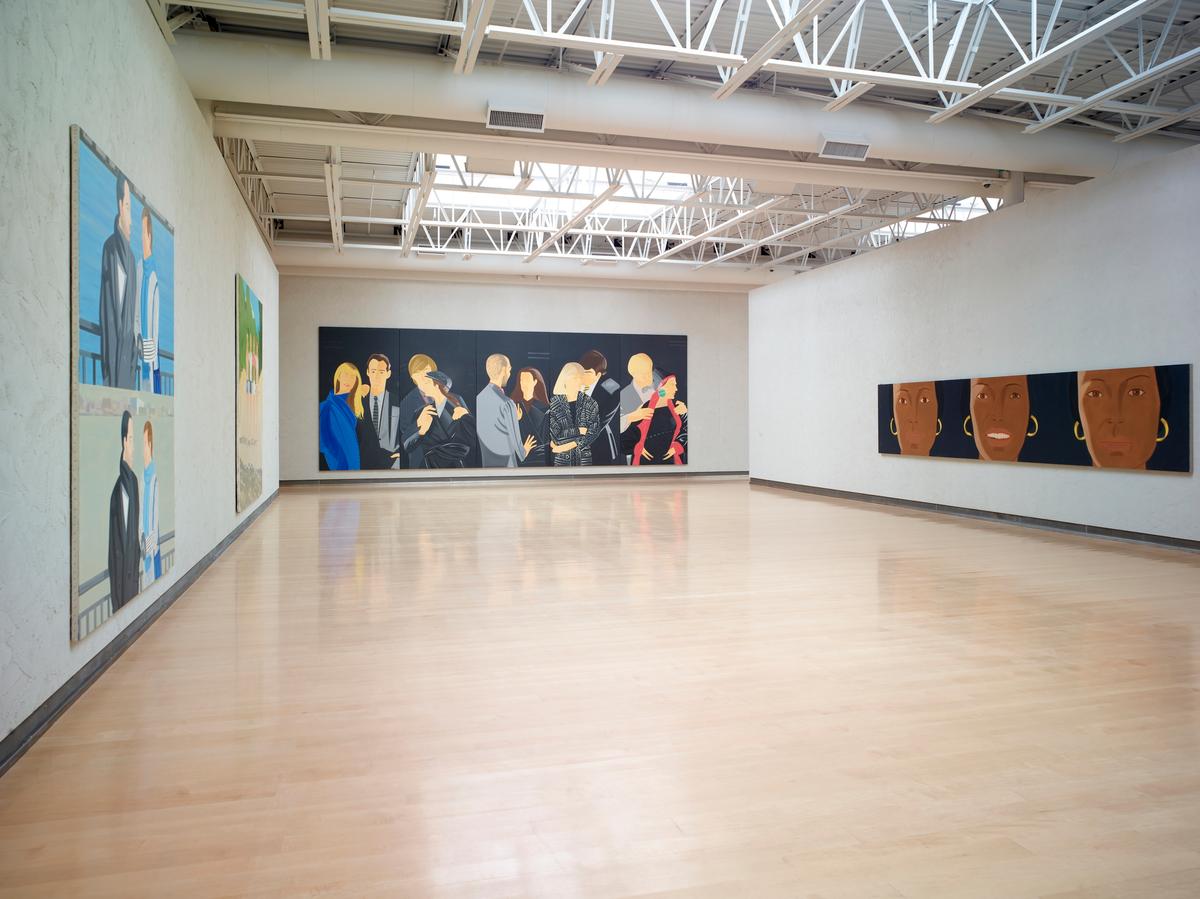 Gallery with group of four large scale figurative paintings displayed across three walls.
