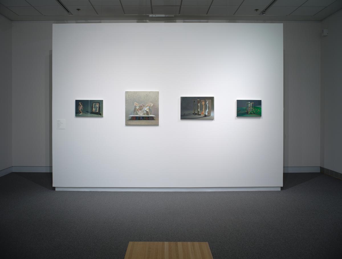 Four figurative paintings in a row on a white gallery wall with a wooden bench in the foreground