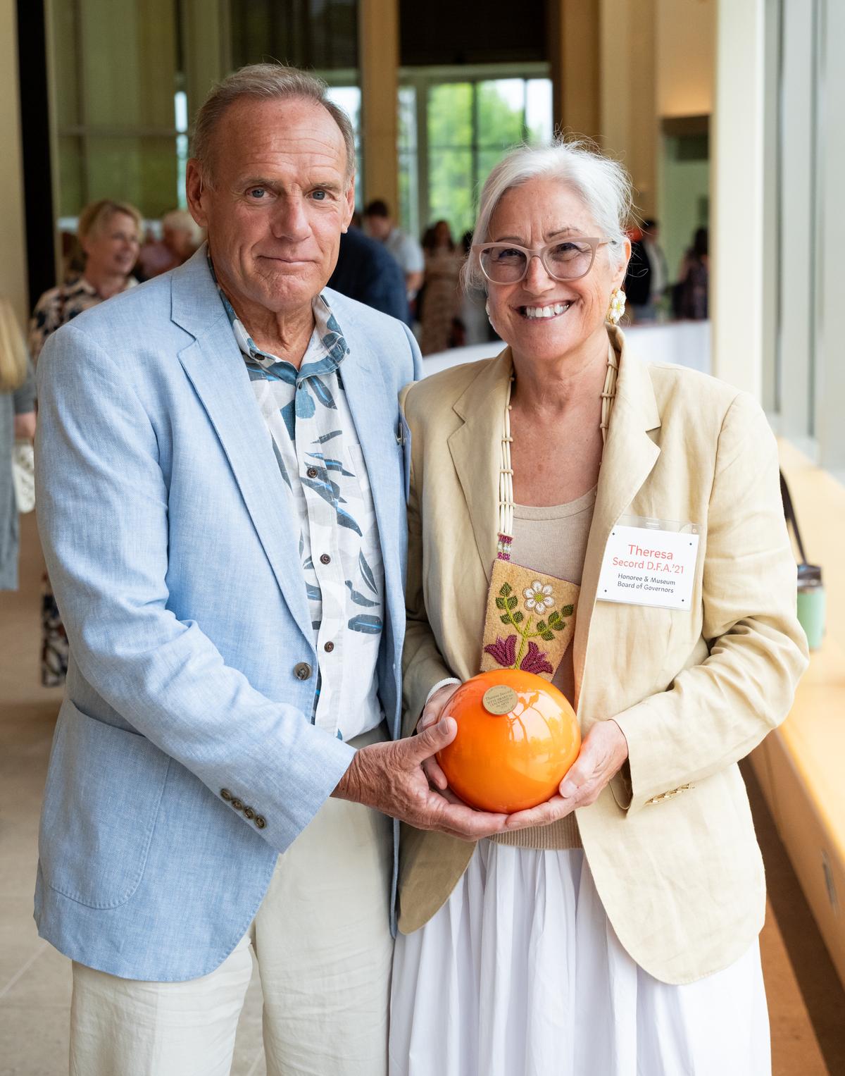 Bill Marceau and Theresa Secord, holding an award, posed for a picture