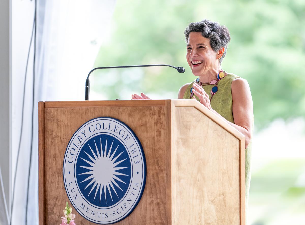 Jacqueline Terrassa giving remarks from Colby College podium.