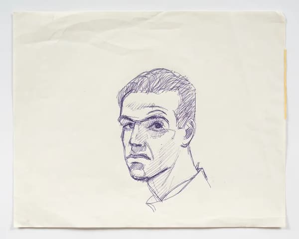 A sketch of a man’s head and neck in blue ink on a slightly creased sheet of off-white paper. He is turned in a three-quarter view, looking forward with a serious expression, rendered using quick lines and cross-hatched shading.