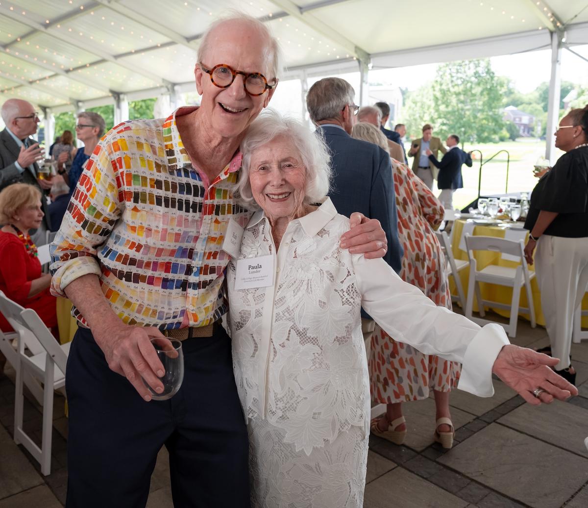 Paula Lunder and Rob Radloff smile for a photo at the Summer Luncheon.