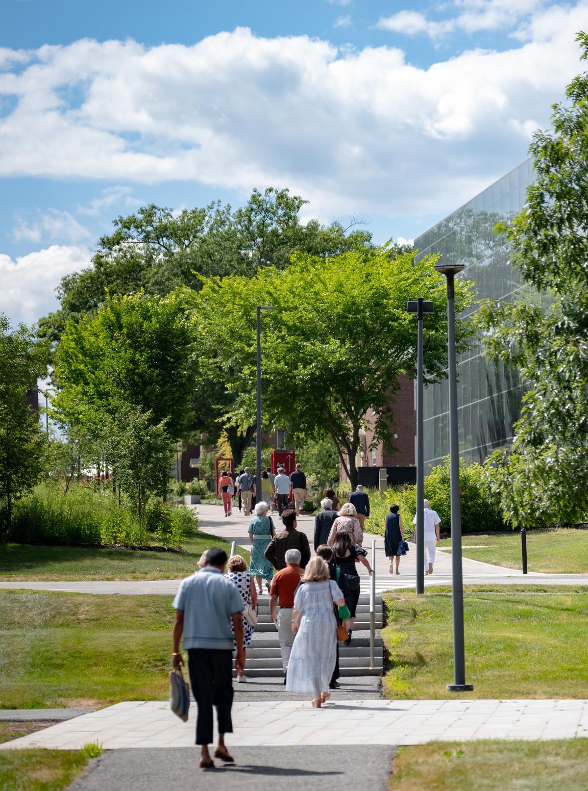 People walking up a path to the Colby College Museum of Art.