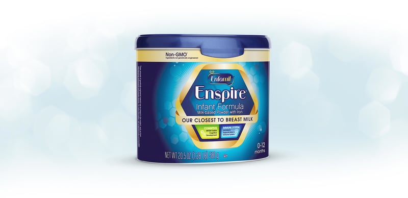 Enspire infant formula tub photographed straight on against a soft white gradient with faint bokeh