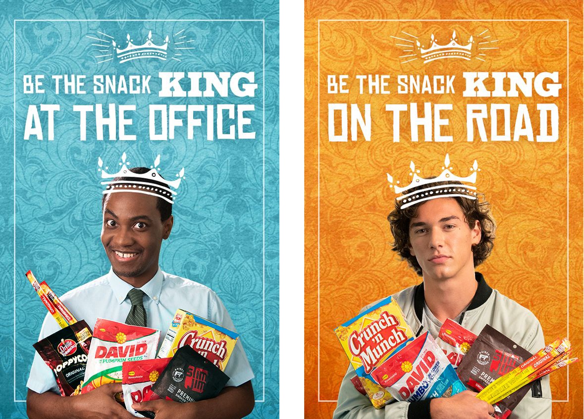Two advertising panels showing men wearing paper crowns and holding armfuls of snack packets