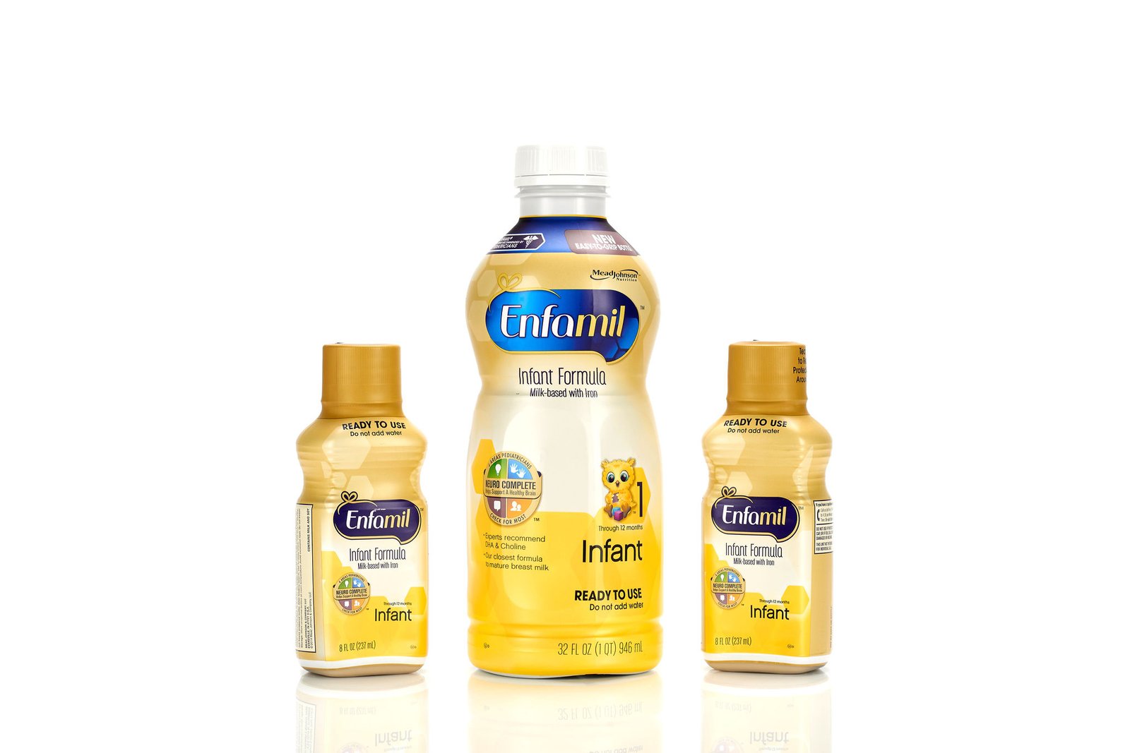 Three bottles of Enfamil infant formula grouped on white