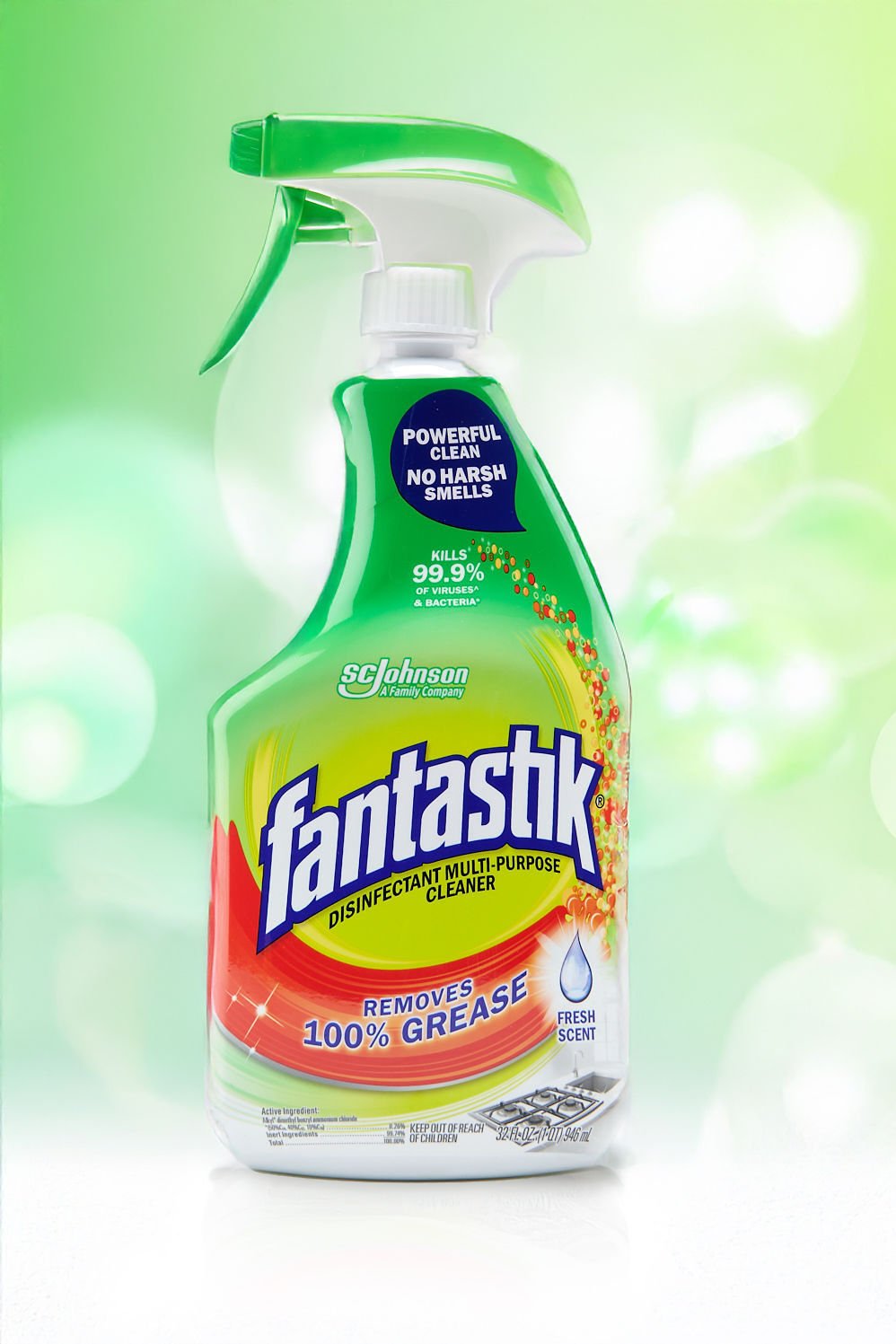 A bottle of Fantastik spray cleaner against a bright green backdrop