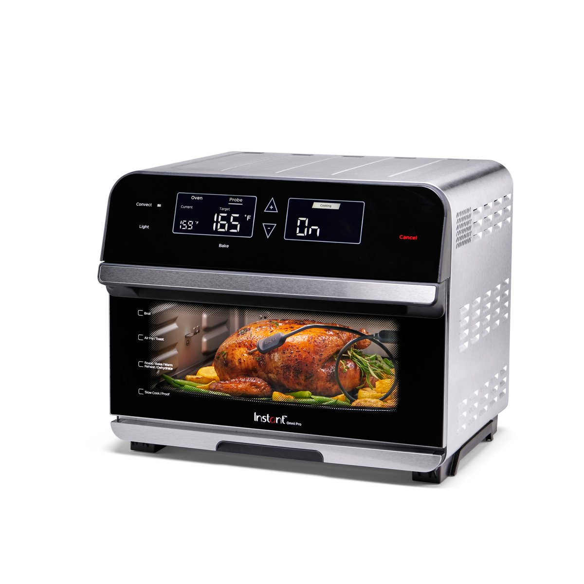 An Instant Pot air fryer oven with a roast chicken inside, photographed on white