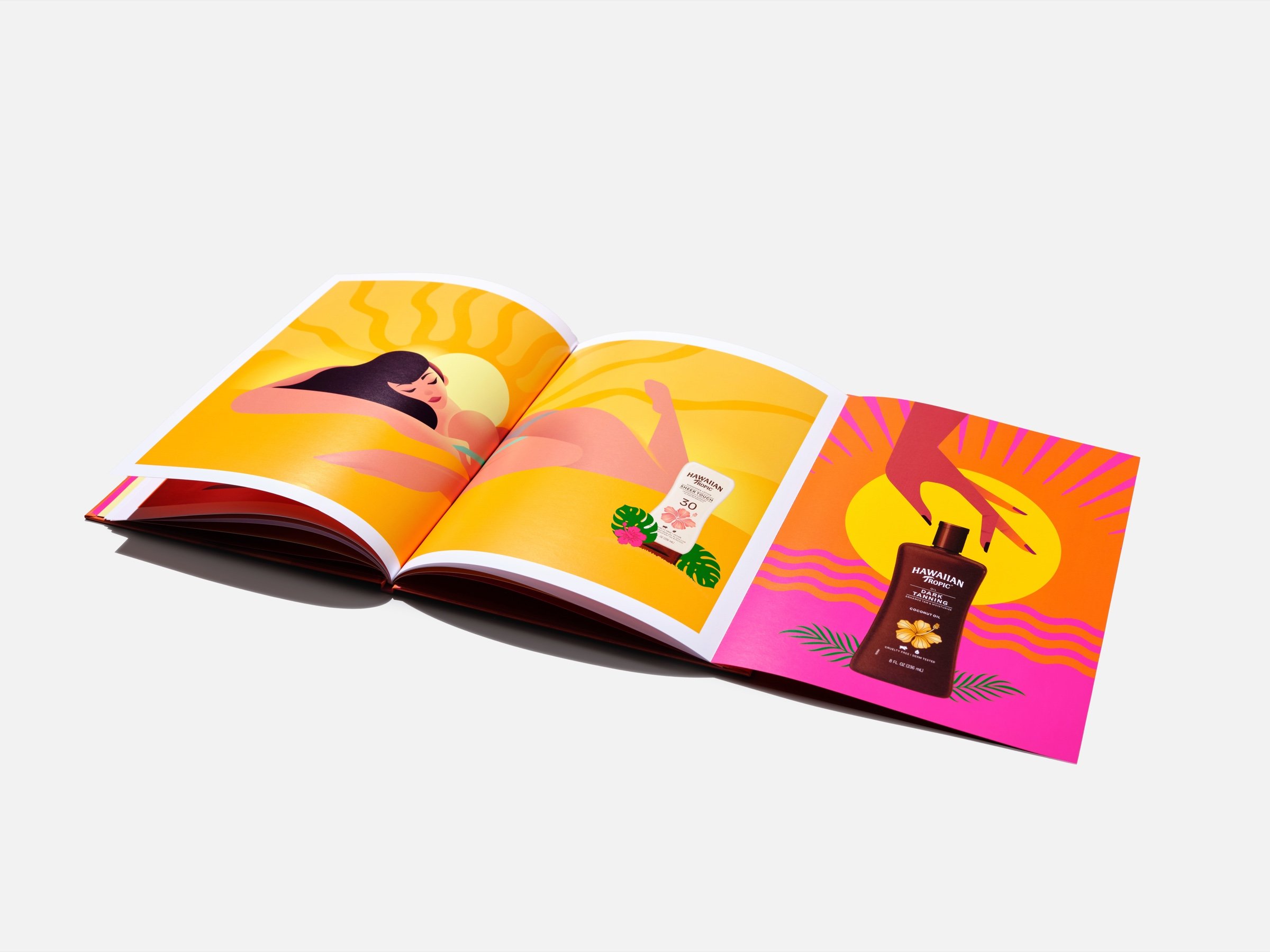 An open children's picture book with brightly illustrated pages, photographed on white