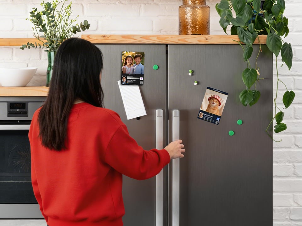 Realtor-style personalized magnets displayed on a fridge