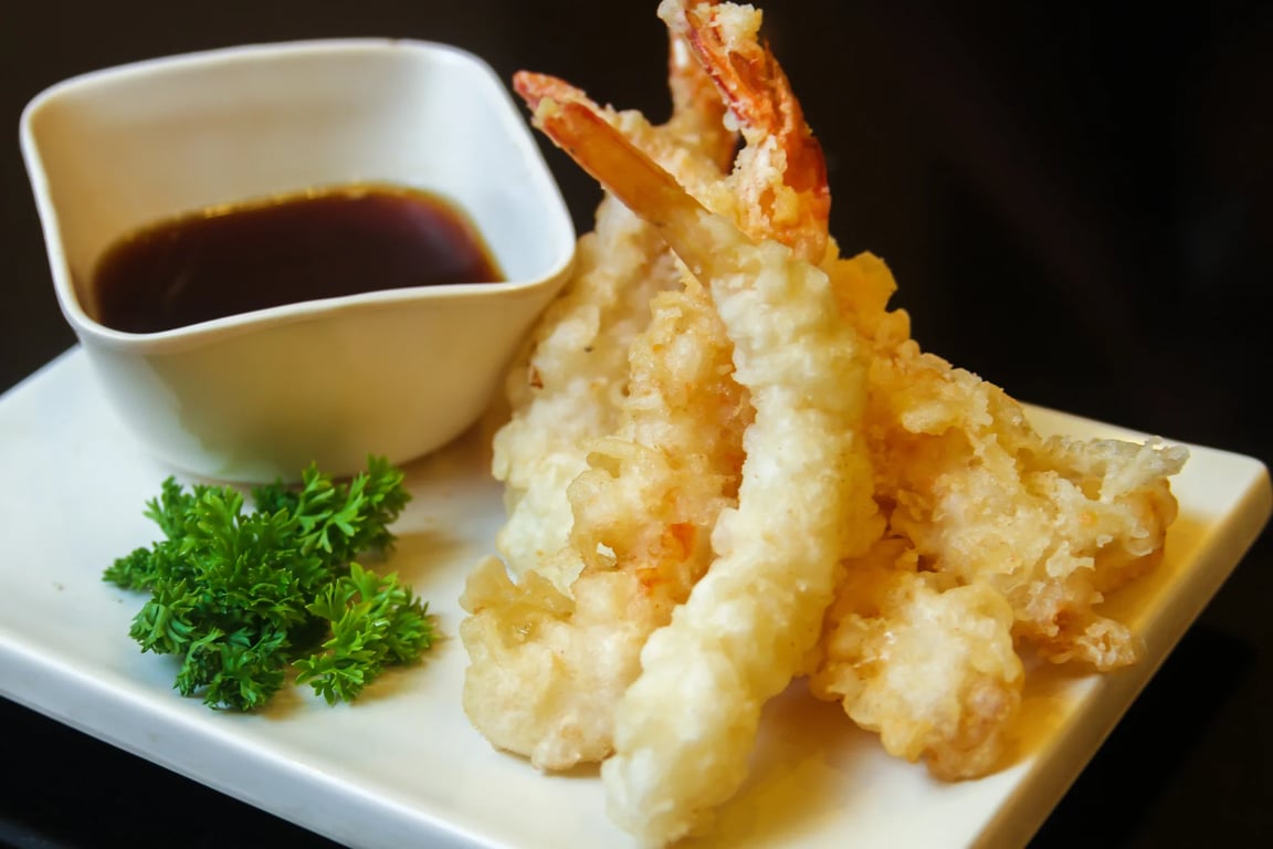 fried-shrimps-with-greens-garnish-sauce-served-white-flat-tray.jpg
