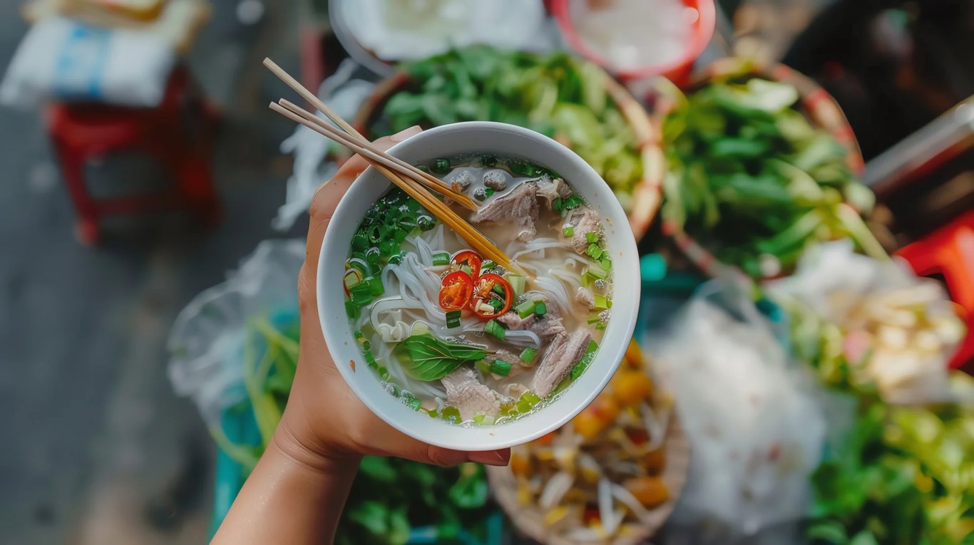 hand-holds-bowl-vietnamese-pho-soup-with-chopsticks.jpg
