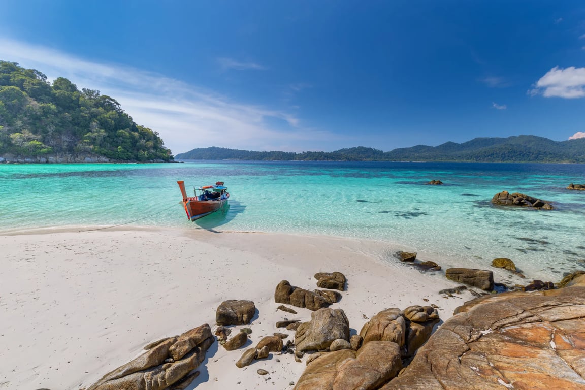 long-tail-boat-white-sand-beach-tropical-island-thailand.jpg