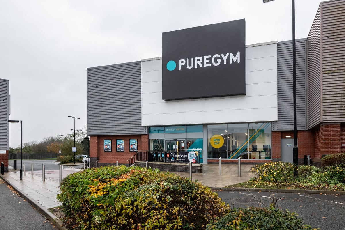 PureGym Derby Kingsway Retail Park: The gym's exterior, brick building with signage and parking lot.