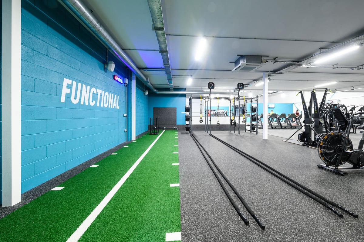 PureGym Cardiff Bay: Functional training area with turf track, battle ropes, weighted sleds.