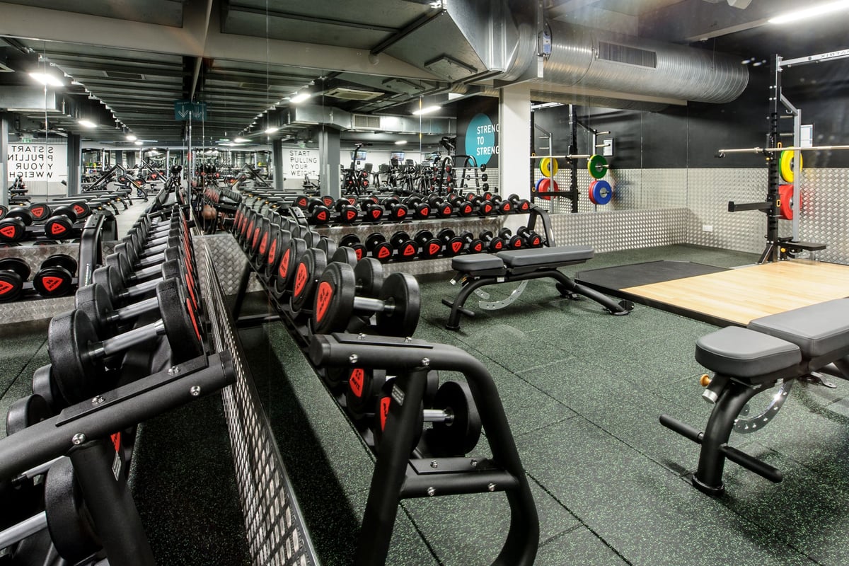 PureGym London Wembley: Rows of stationary bikes, dumbbells galore, rubberised flooring in a well-equipped gym.