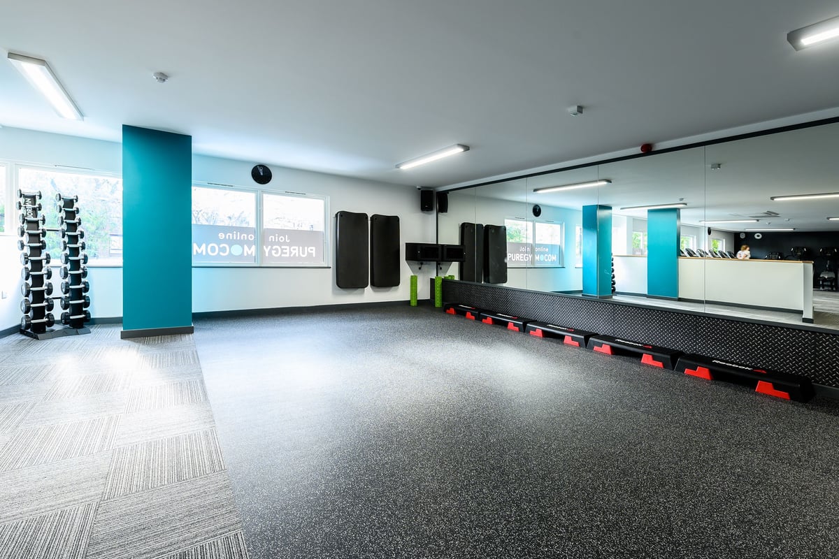 PureGym London Camberwell Southampton Way: Gym studio with floor mats, free weights, resistance machines, and mirrored walls.