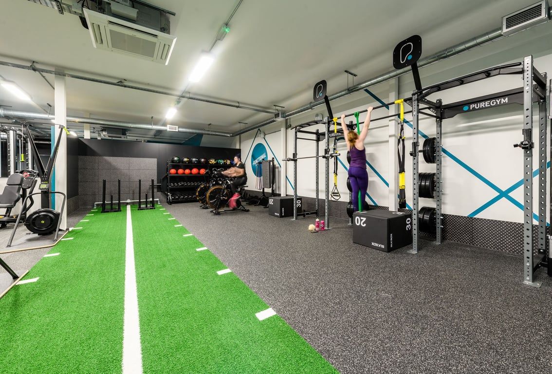 PureGym Swindon Mannington Retail Park: Rig structure, resistance bands, green turf, free weights, mirrored wall