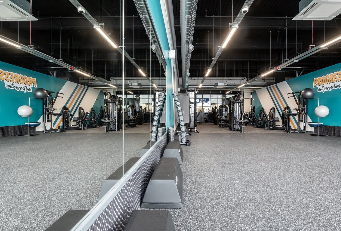 PureGym Edinburgh Ocean Terminal: Resistance machines, free weights, benches, and rubberised flooring in gym studio.