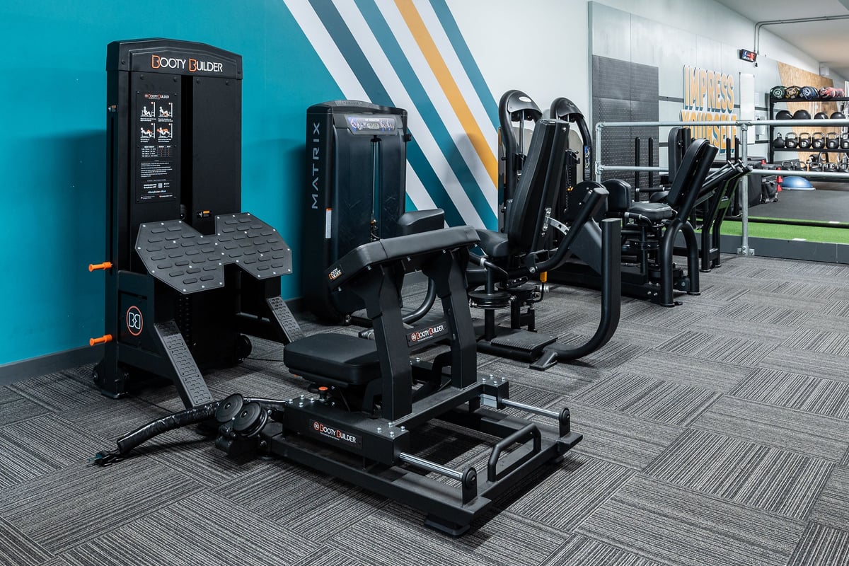 PureGym Manchester Cheetham Hill Retail Park: Weight machines, squat racks, weight plates, and resistance equipment.