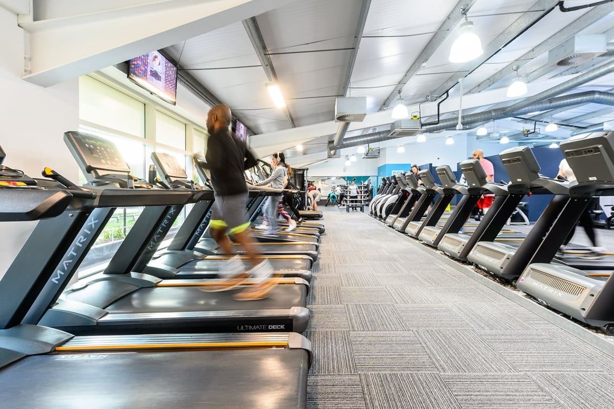 PureGym Oxford Templars Shopping Park: Rows of treadmills and other cardio machines in a bright gym interior.