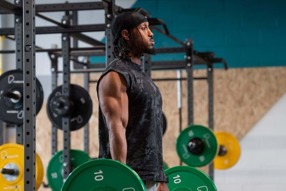 PureGym member using a barbell