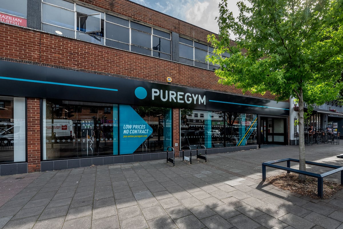 PureGym London Welling: Fitness studio exterior with teal branding, benches outside.
