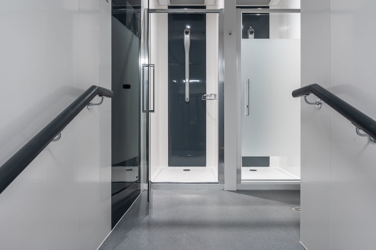 PureGym Airdrie: Accessible showers, handrails, and non-slip flooring in a changing facility.