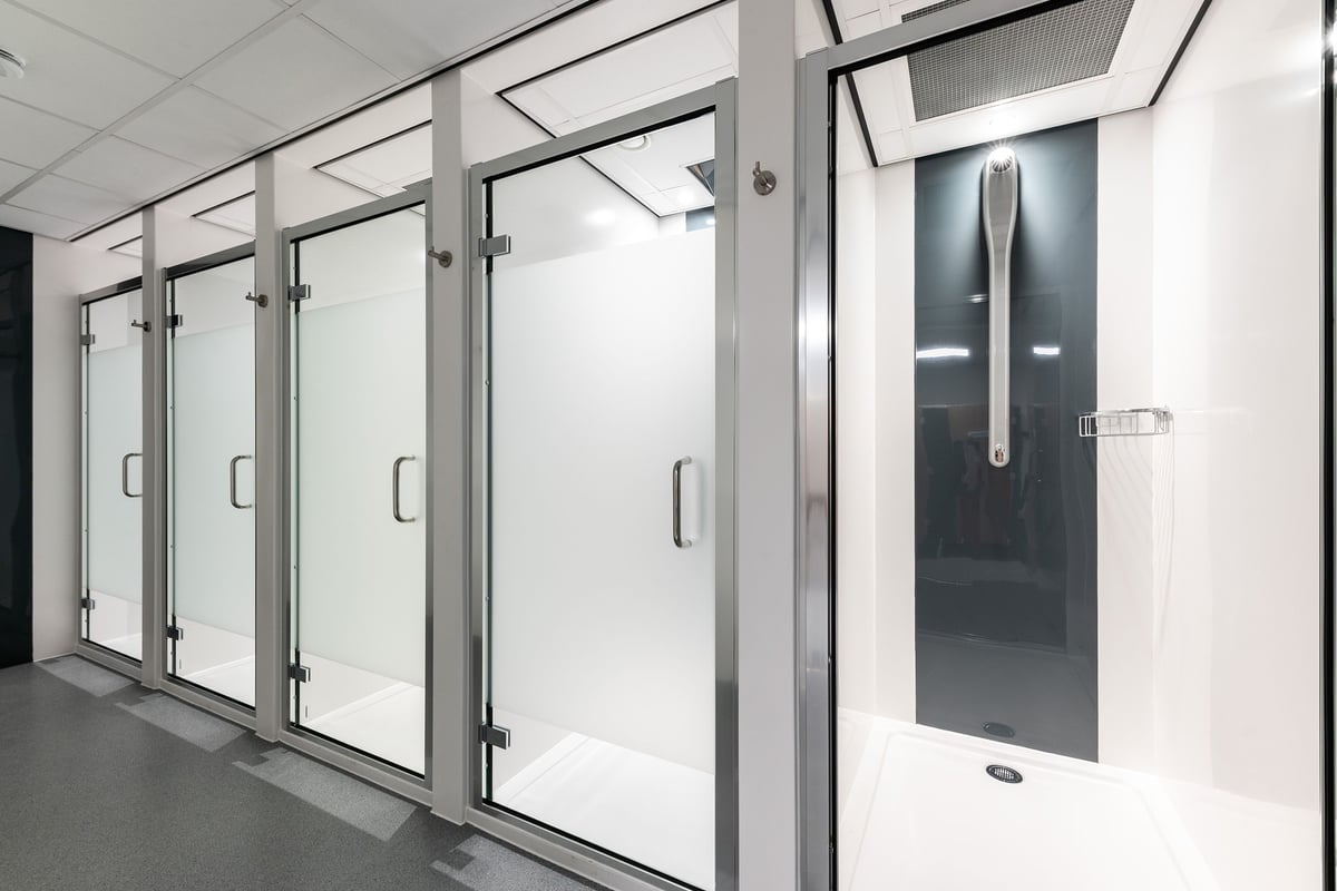 PureGym Broadstairs Westwood Gateway Retail Park: Fully enclosed shower stalls with frosted glass doors.