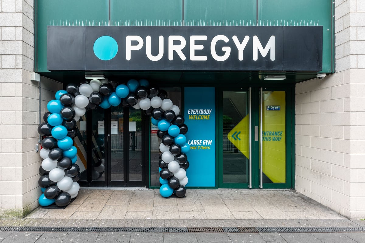PureGym Newcastle Eldon Garden: Exterior of a gym with blue and white balloon arch at entrance.