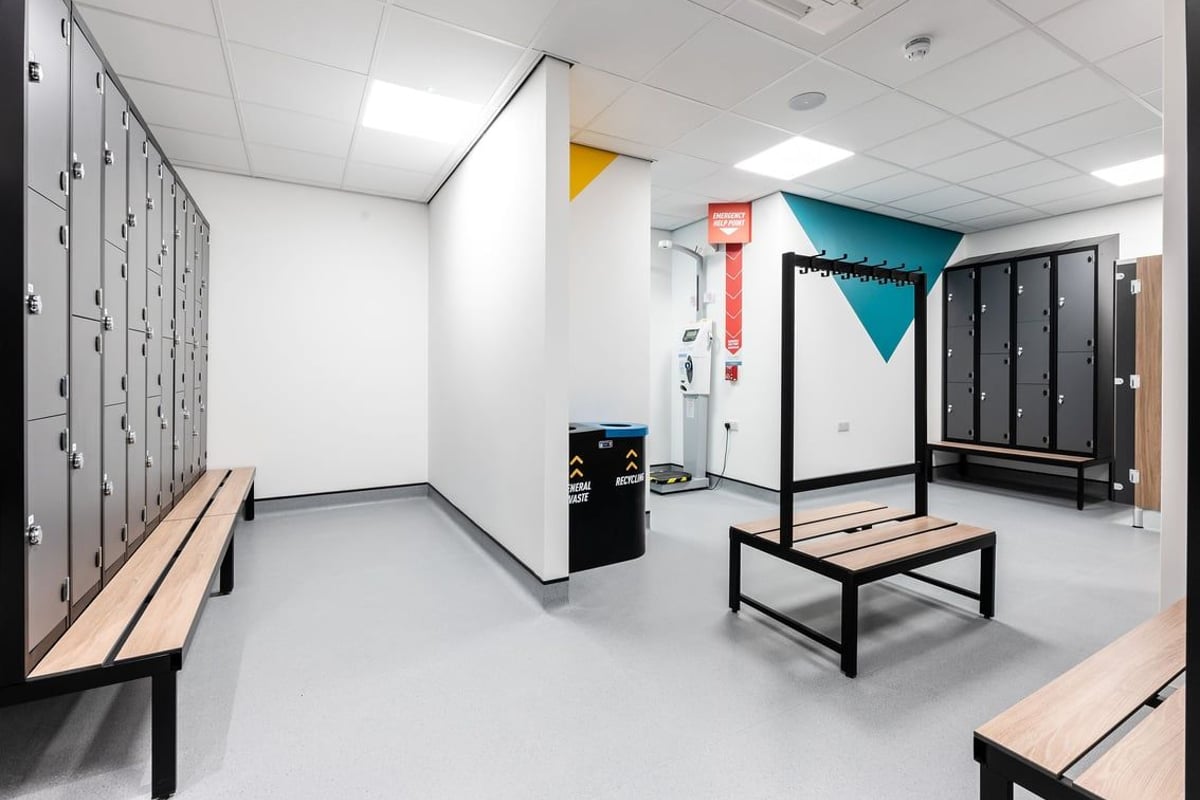 PureGym Blyth: Locker room benches, lockers, and changing cubicles.