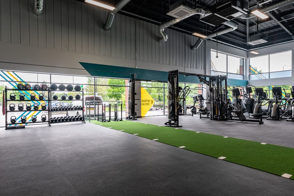 PureGym Doncaster: Weight racks, medicine balls, rubberised flooring, turf area in spacious gym studio.