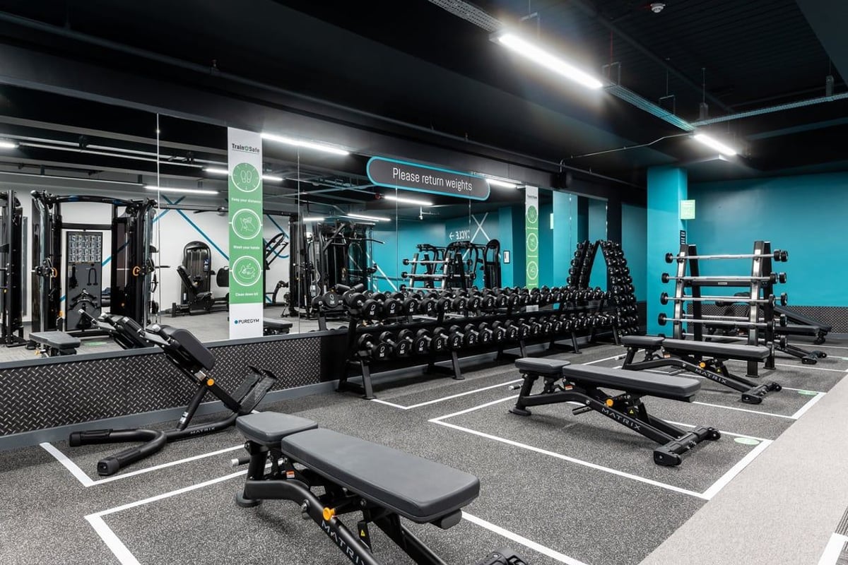 PureGym London Bank: Free weights, benches, resistance machines, and rubberized flooring in a sleek gym setting.