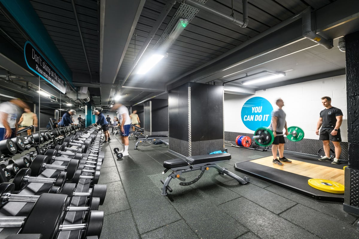 PureGym London Lambeth: Rows of dumbbell racks, treadmills, weight benches, and motivational signage.