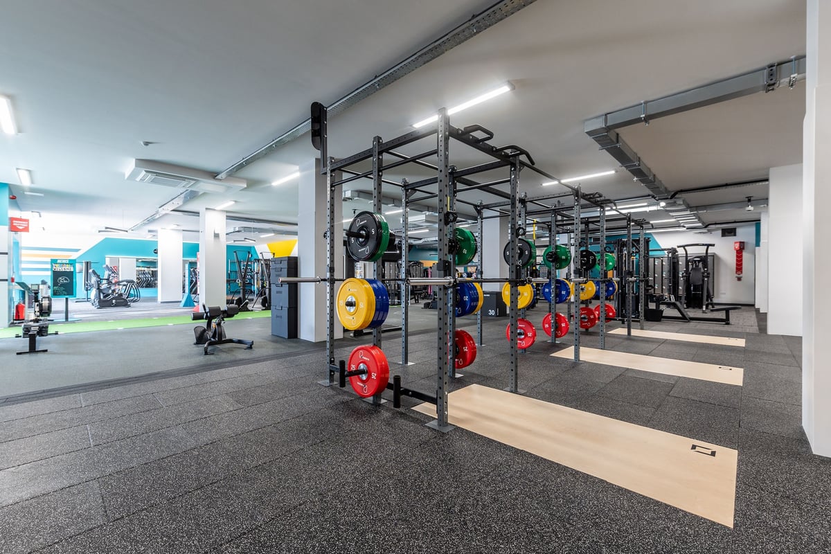 PureGym Coalville: Weight racks, resistance machines, rubberised floors, colorful weight plates.