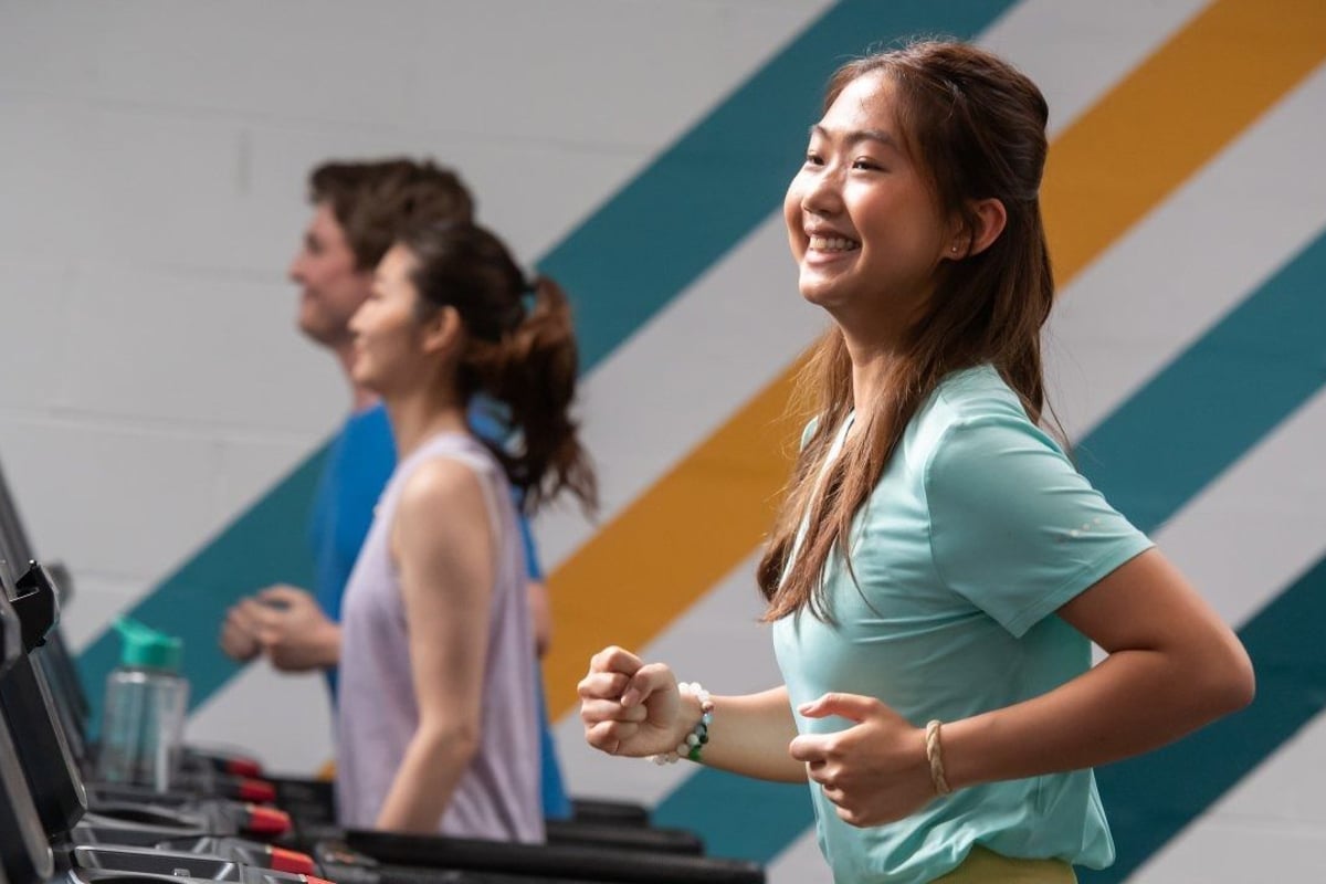 Female gym goer running on a treadmill