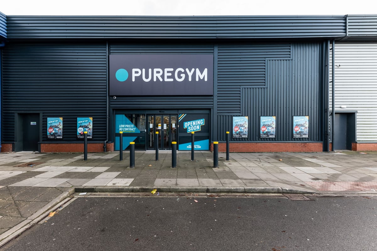 PureGym Boston: Building exterior with Pure Gym signage and poster displays visible.
