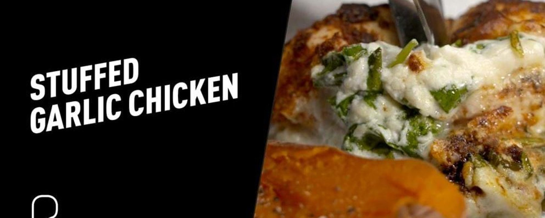 Stuffed chicken breast with melted cheese being lifted with a fork