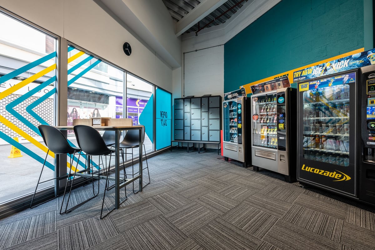 PureGym Nuneaton hub with vending machines and seating area