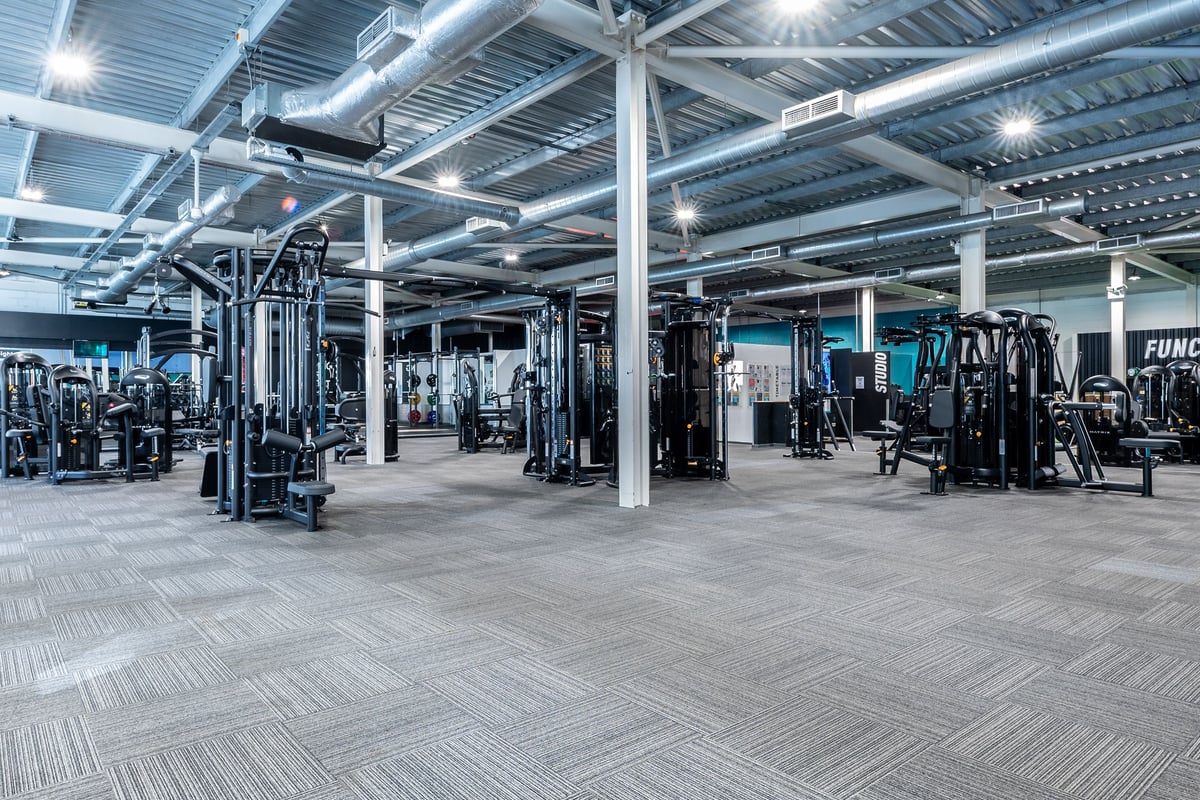 PureGym Bristol Union Gate: Gym interior with weight machines, free weights, mirrors, and rubberized flooring visible.