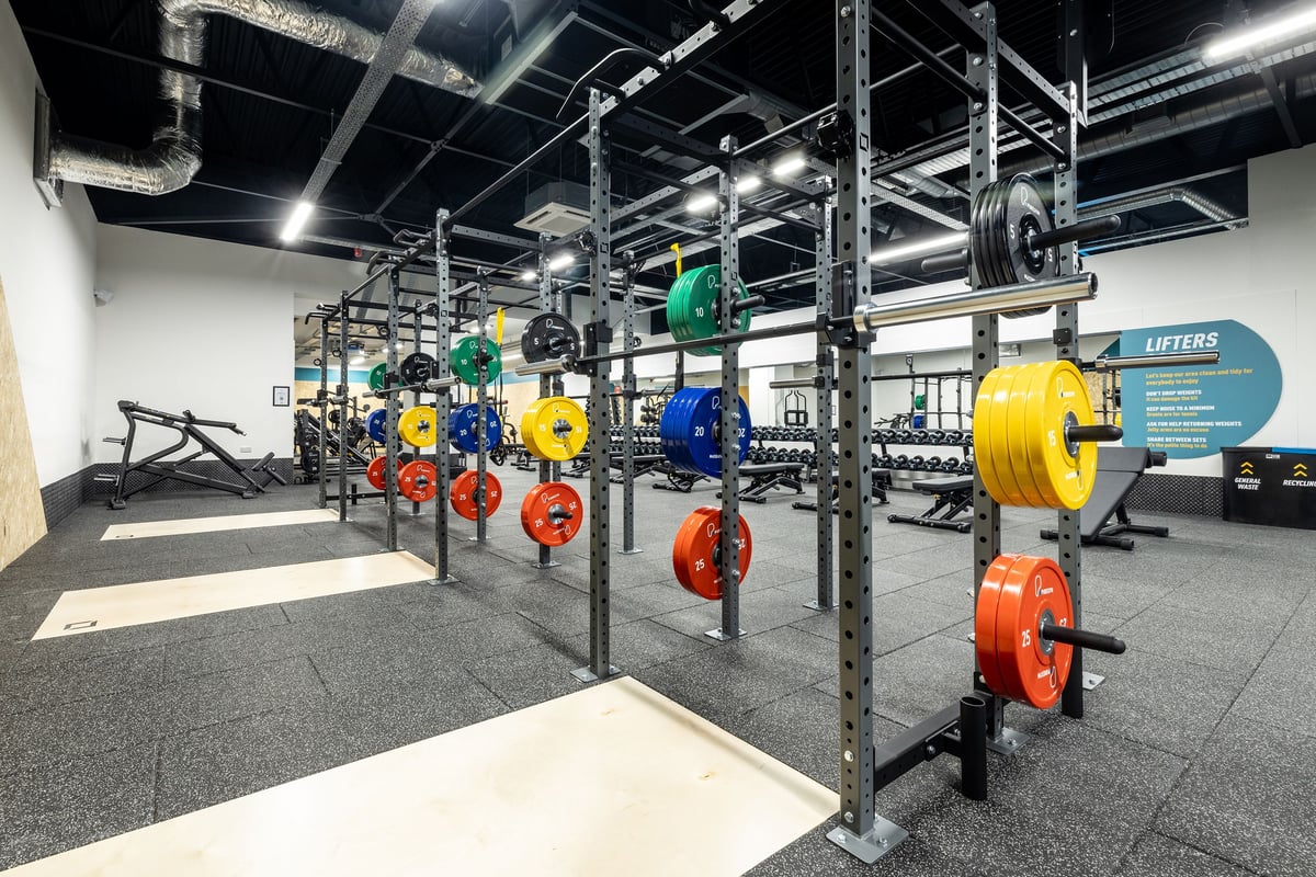PureGym Washington: Racks housing colourful weight plates, barbells and medicine balls on rubberized flooring.