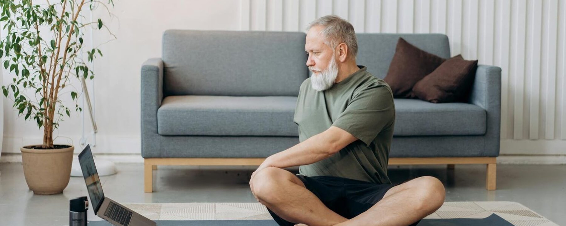 Man doing home workout on a yoga mat