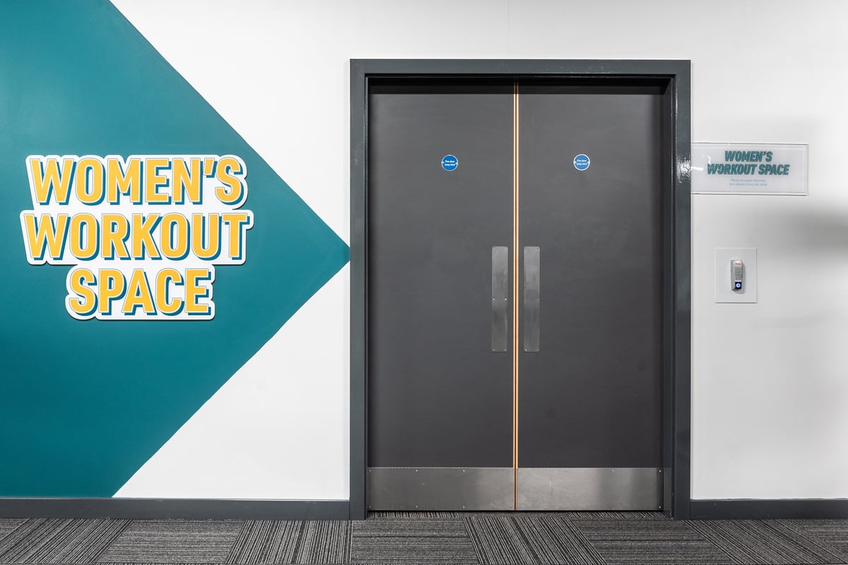 PureGym Bradford Thornbury: Double doors labeled "Women's Workout Space" with equipment visible beyond.