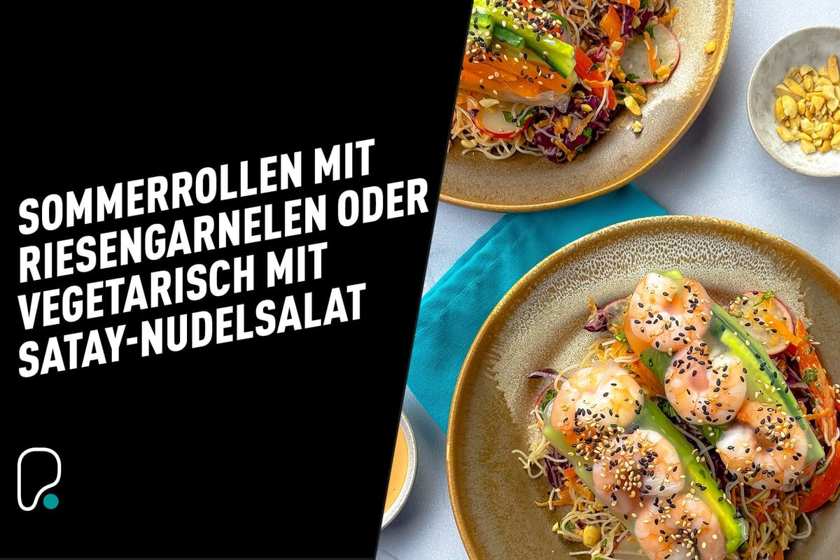Two plates with summer rolls filled with prawns and vegetables on a noodle salad.