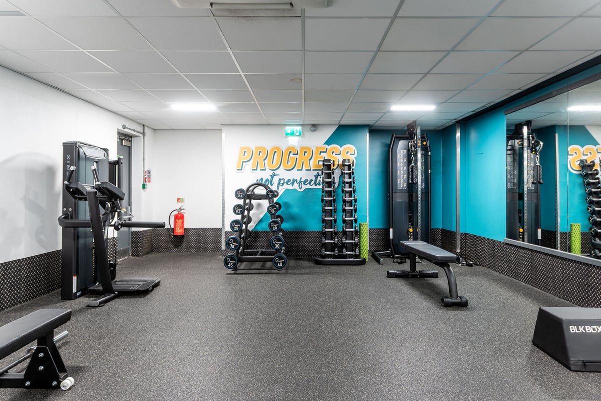 PureGym Northolt: Resistance machines, benches, free weights, rubberized flooring in a gym studio setting.