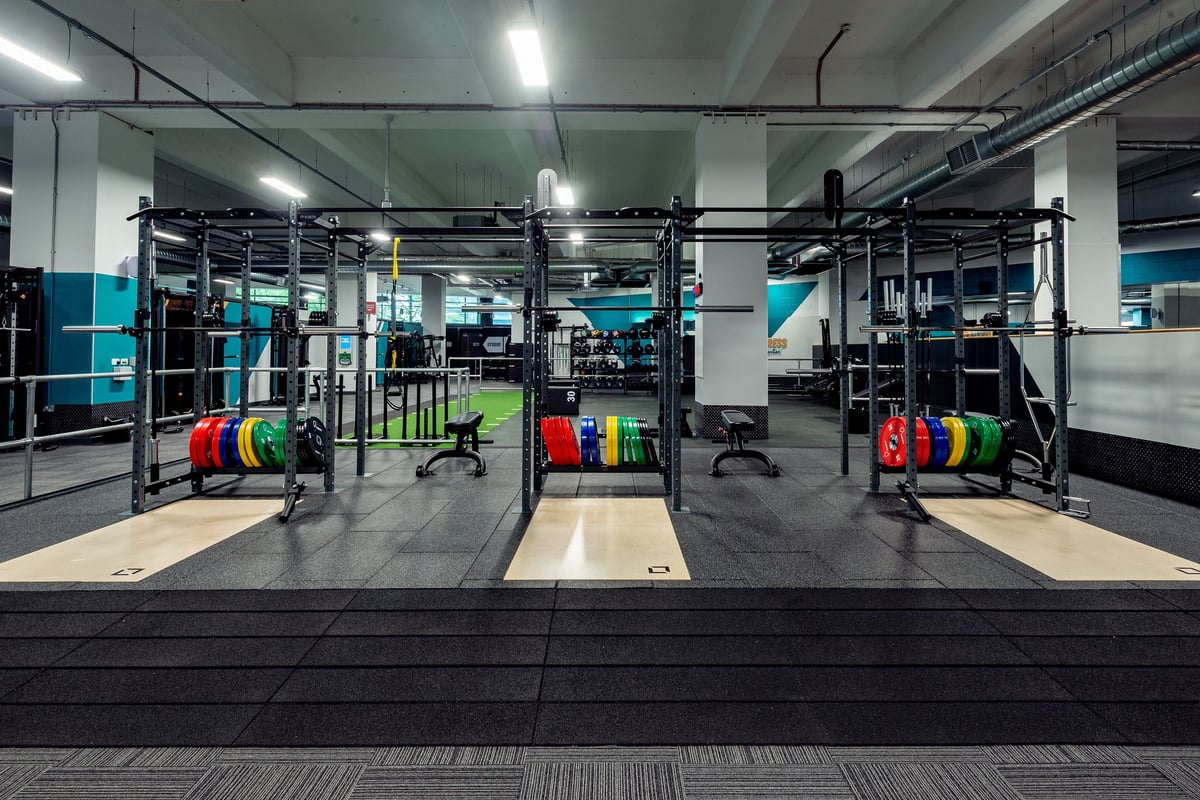 PureGym Leicester St Georges Way: Rig frames, weight plates, benches, and rubberised floors in a CrossFit-style gym.