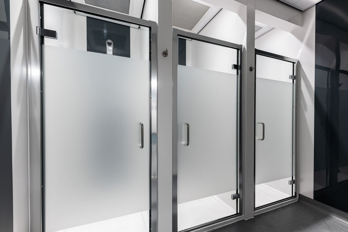 PureGym Lincoln Carlton Centre: Shower stalls with frosted glass doors.